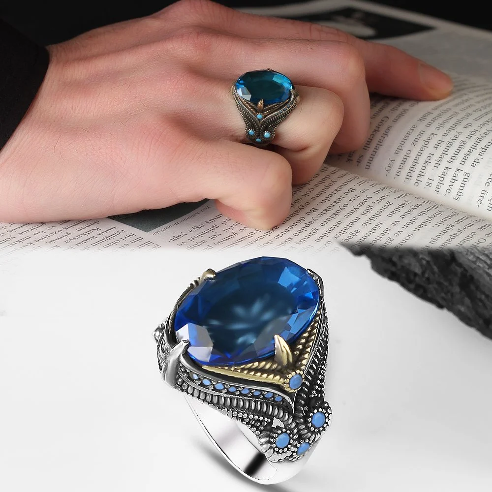 A men's sterling silver ring, 925 purity, with a blue topaz stone
