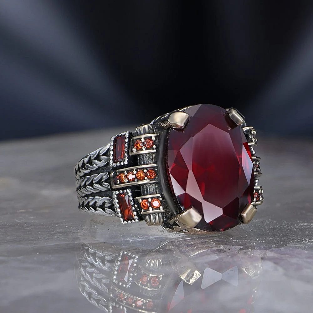 A men's sterling silver ring, 925 purity, with a garnet zircon stone