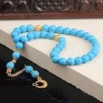 سبحة من حجر الفيروز مطلية بالذهب مع شرابات فضية
