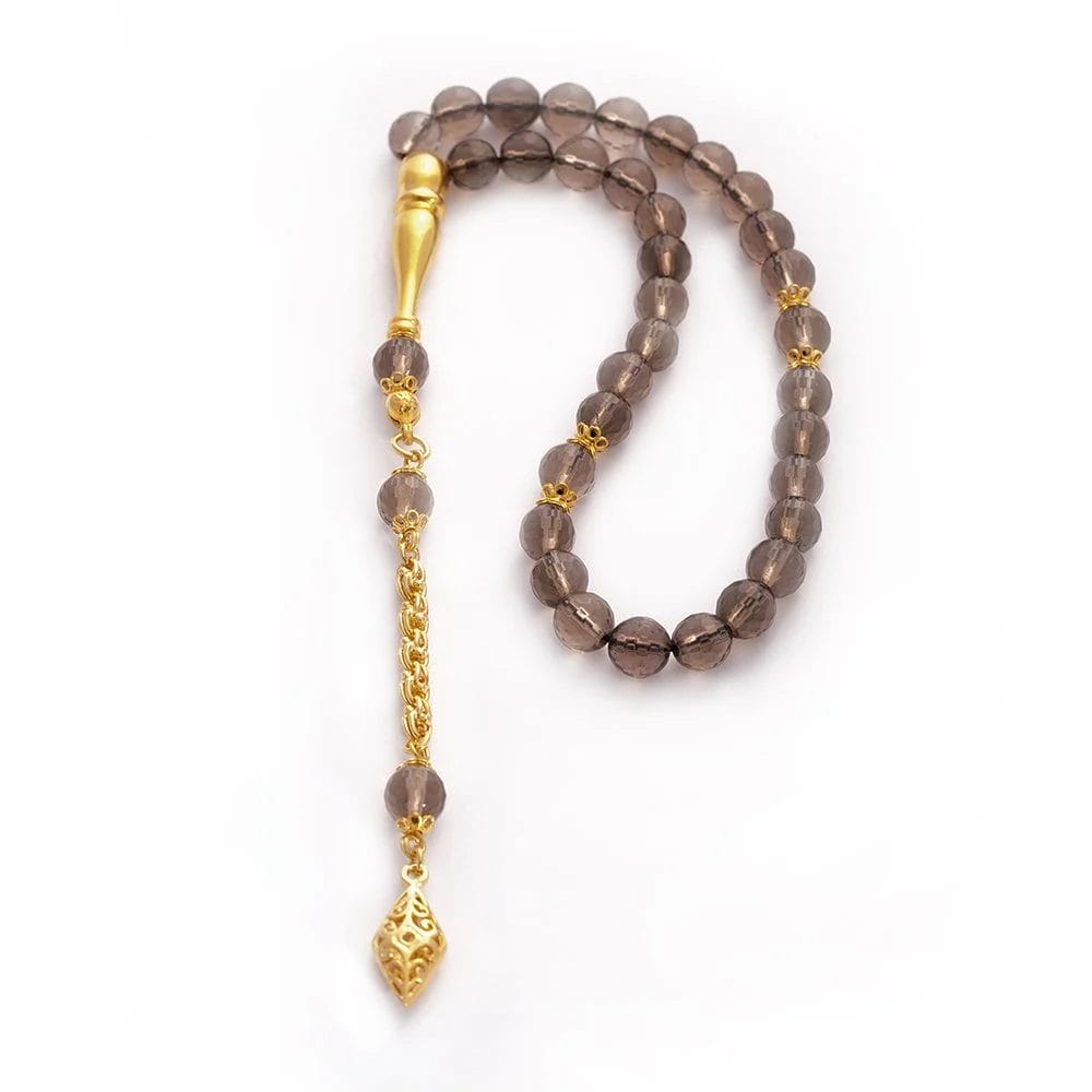 سبحة حجر كوارتز كريستال مع شرابات ذهبية سبحة حجر كوارتز كريستال مع شرابات ذهبية